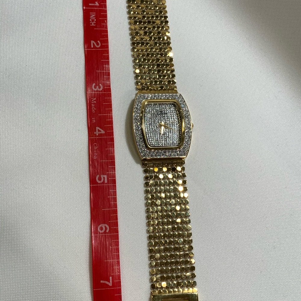 Gold chained watch, with crystaled face